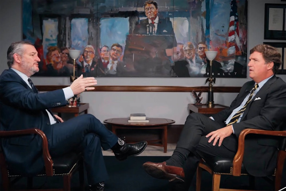 Tucker Carlson interviews Sen. Ted Cruz in front of a Ronald Reagan painting