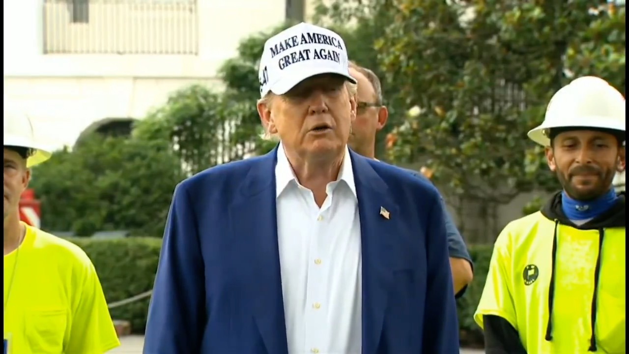 Trump speaking outside White House, gesturing while criticizing Jerome Powell