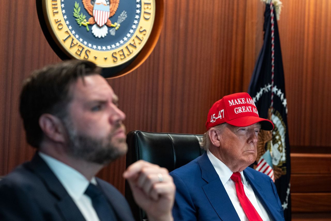 Donald Trump wearing MAGA hat in Situation Room next to JD Vance