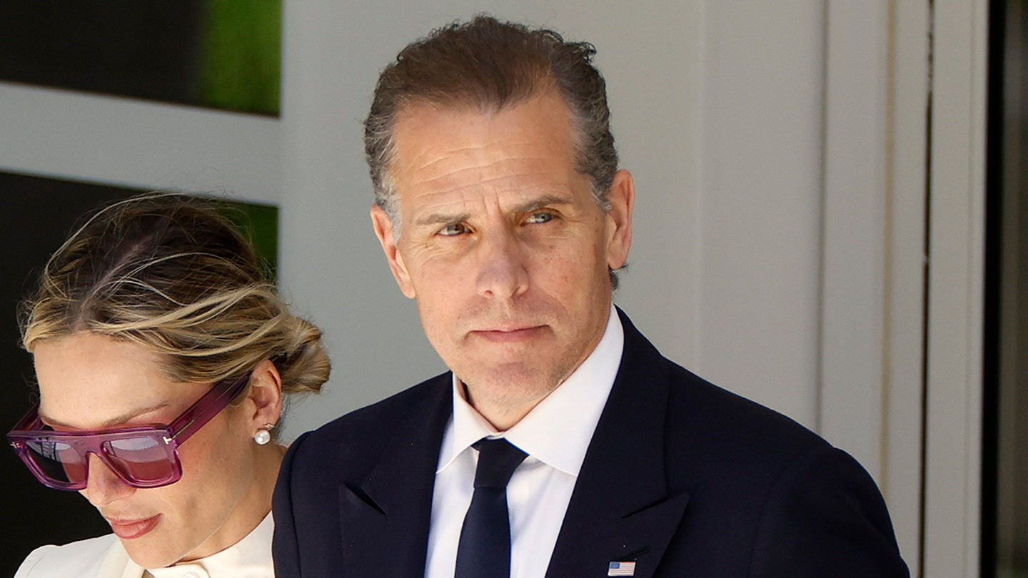 Hunter Biden in suit with woman in sunglasses
