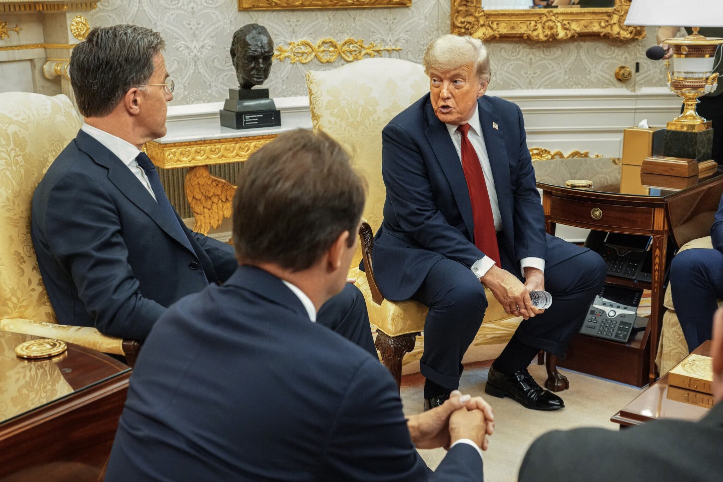 Donald Trump speaks with foreign leaders during a White House meeting