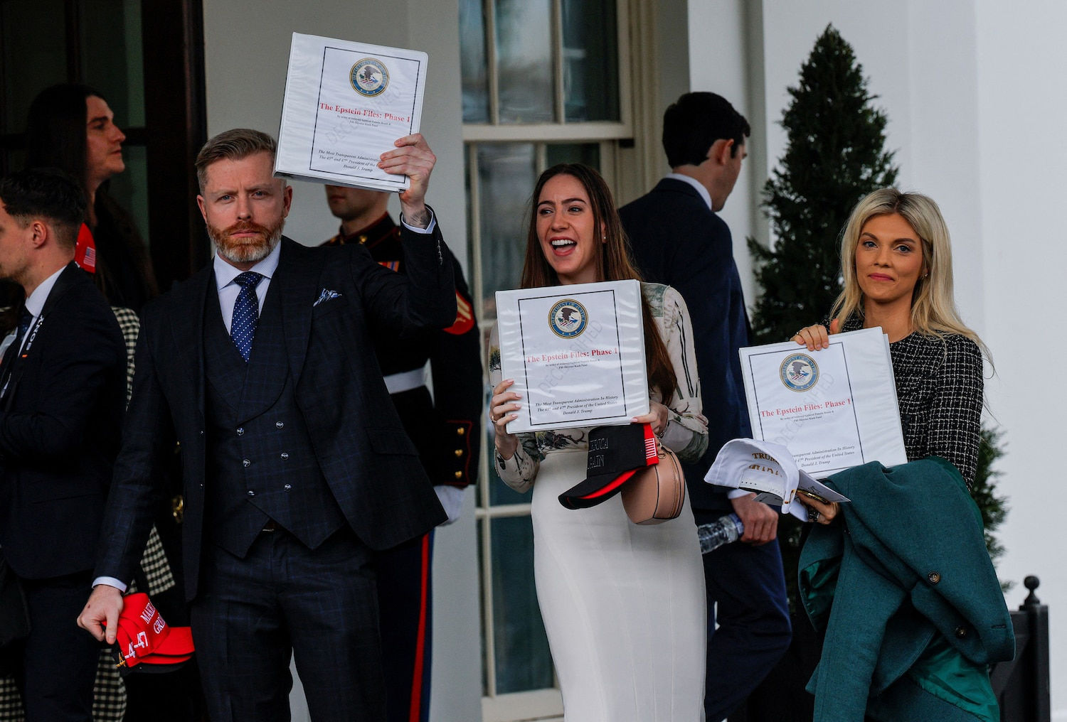 Pam Bondi supporters holding Epstein Files binders outside White House