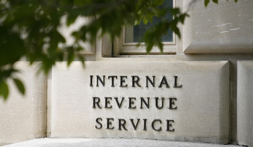 IRS building exterior with budget cuts protest signage
