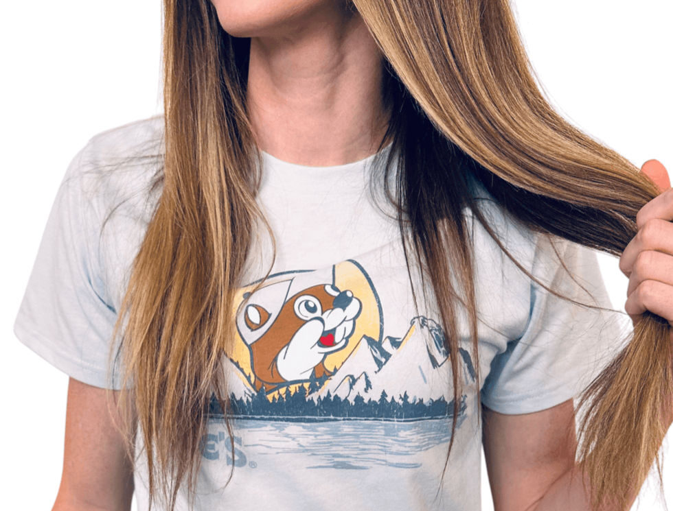 Woman wearing Buc-ee’s t-shirt pulling hair playfully
