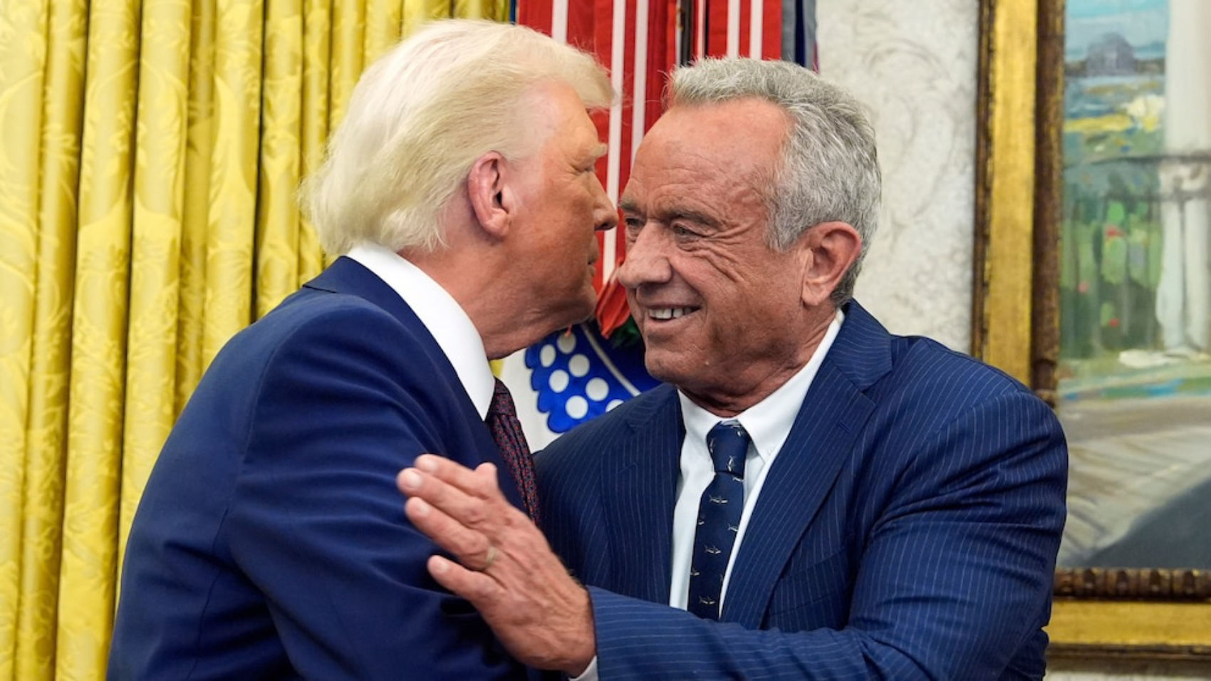 Trump and Robert F. Kennedy Jr. smiling during White House event
