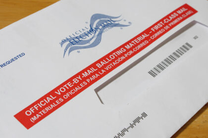 Official vote-by-mail ballot envelope on a table