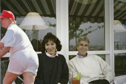Ghislaine Maxwell and Jeffrey Epstein sitting together outdoors.