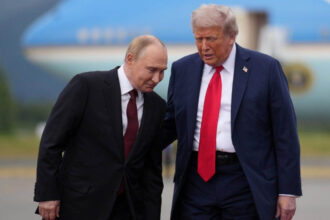 Donald Trump and Vladimir Putin walking together near Air Force One