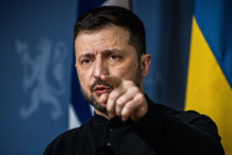 Ukrainian President Volodymyr Zelensky pointing during a press conference