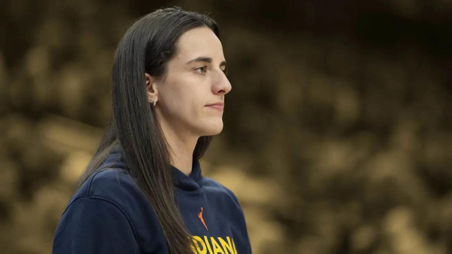 Indiana Fever guard Caitlin Clark on the sideline during a game.