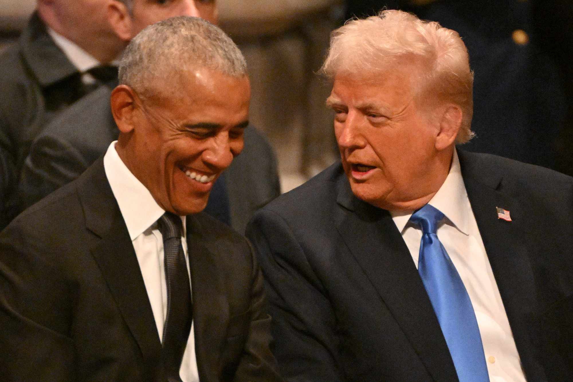 Donald Trump and Barack Obama sitting together at an event