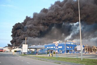 Smoke billowing from destroyed electronics factory in Ukraine after Russian missile strike
