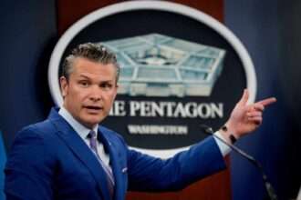 U.S. Defense Secretary Pete Hegseth speaks at the Pentagon press briefing podium.