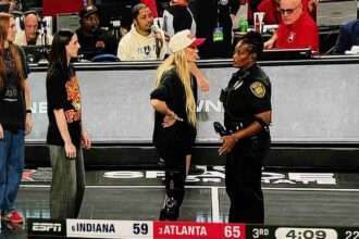 Sophie Cunningham arguing with a police officer during Indiana Fever playoff game