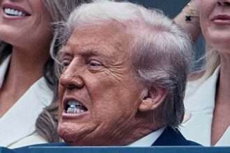 Donald Trump biting a small blue object during the U.S. Open men’s final.
