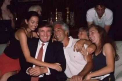 Donald Trump and Jeffrey Epstein sitting together at a party surrounded by women.