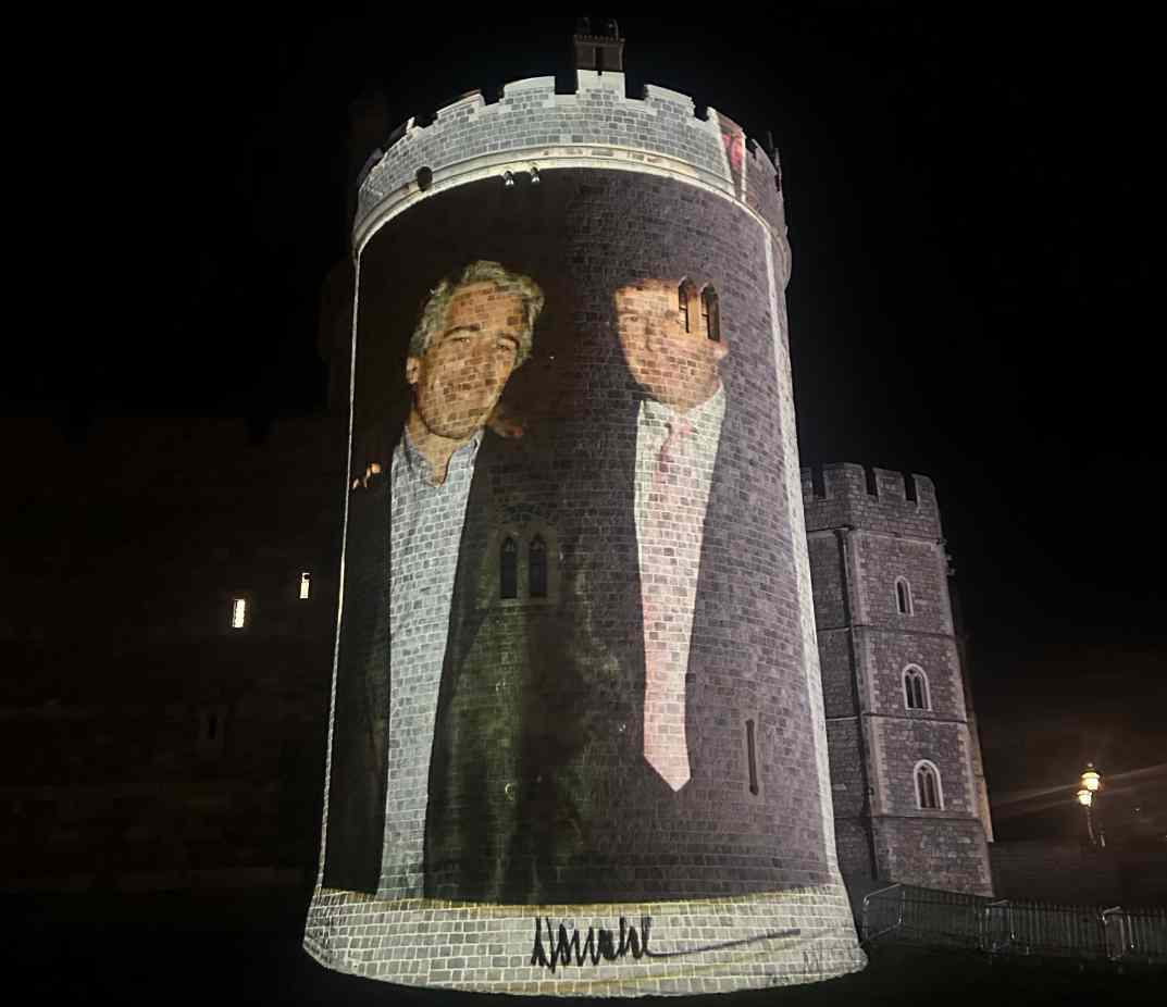 Large protest projection of Trump and Epstein onto Windsor Castle tower at night