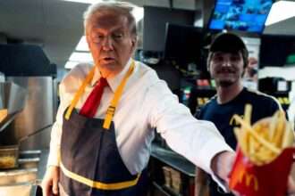 Donald Trump handing fries to a customer at a McDonald’s counter