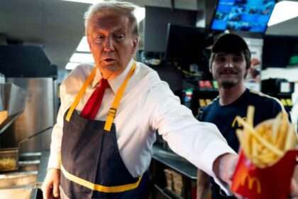 Donald Trump handing fries to a customer at a McDonald’s counter