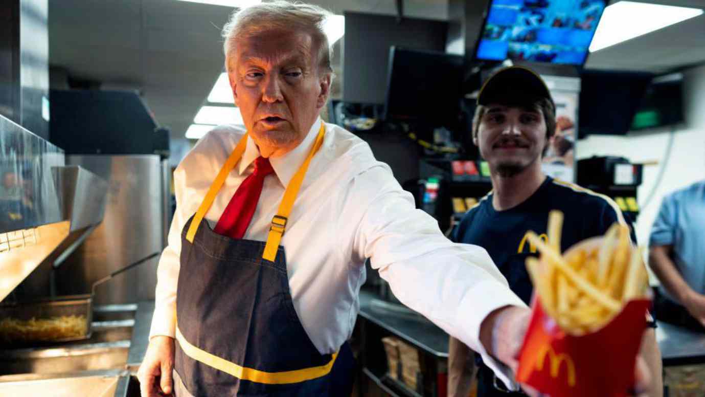 Donald Trump handing fries to a customer at a McDonald’s counter