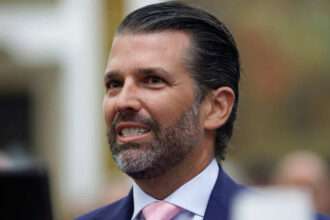 Donald Trump Jr smiling during an event in Washington, D.C.