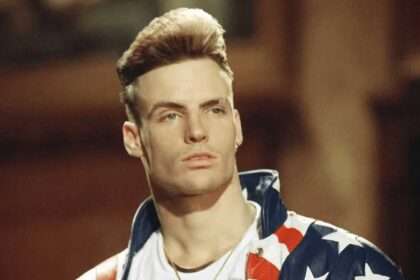 Vanilla Ice wearing a stars and stripes jacket in a promotional portrait.