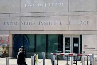 Trump stamps his name on peace while turning the building into a courtroom prop.