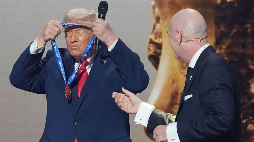 Donald Trump receiving the FIFA Peace Prize medal from Gianni Infantino during a public ceremony